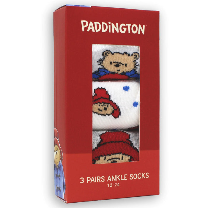 Red box packaging with baby socks set with Paddington character on a white background