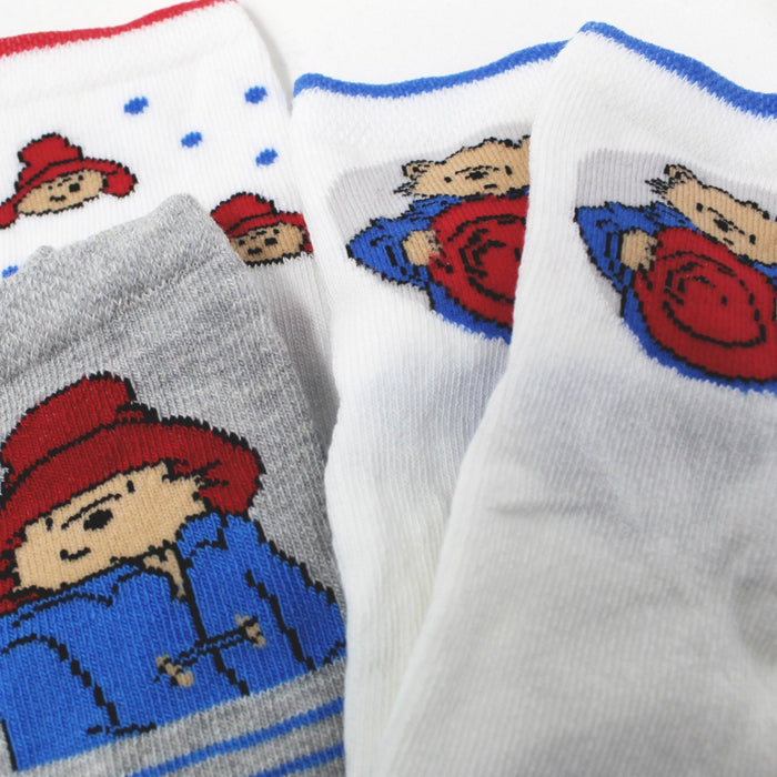 Set of 3 pairs of baby socks with Paddington character on a white background