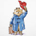 Illustration of a teddy bear in a blue coat and red hat holding a suitcase on a white background