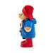 Plush Paddington toy bear in a blue coat, red boots, and red hat on a white background
