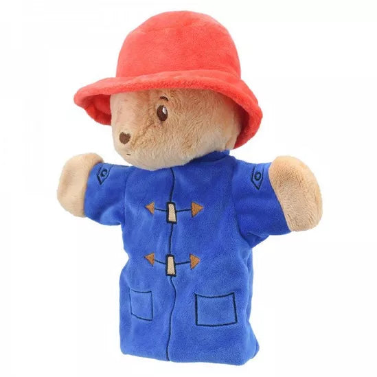 A plush hand puppet of Paddington Bear with a red hat and blue coat.