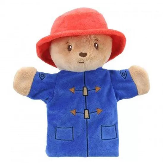 A plush hand puppet of Paddington Bear with a red hat and blue coat.