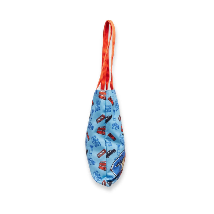 Blue tote bag with vehicle pattern and red handle on a white background