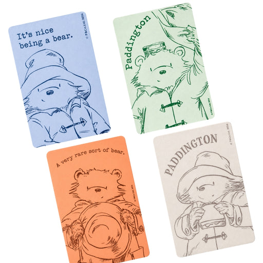 Four small magnets with illustrations of Paddington Bear on a white background