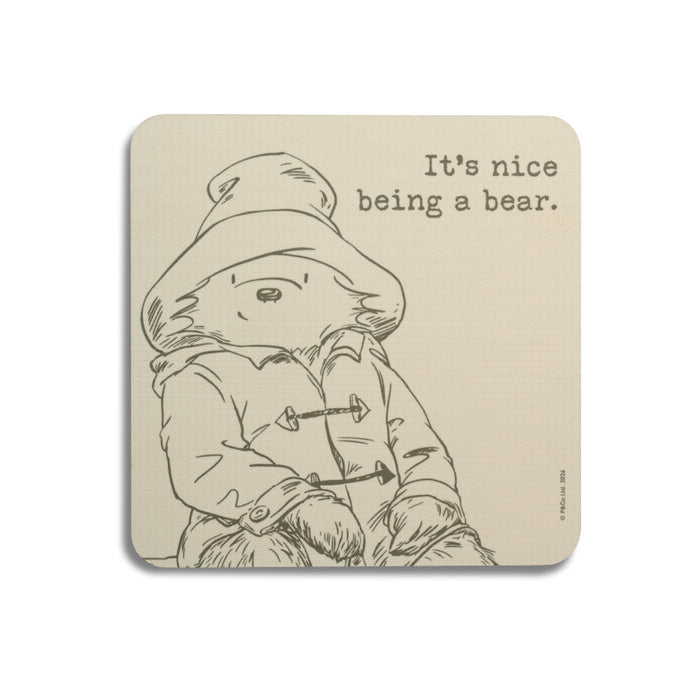 A cream Paddington coffee table coaster with sketch and quote
