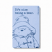 Magnet with a bear illustration and text on a light blue background