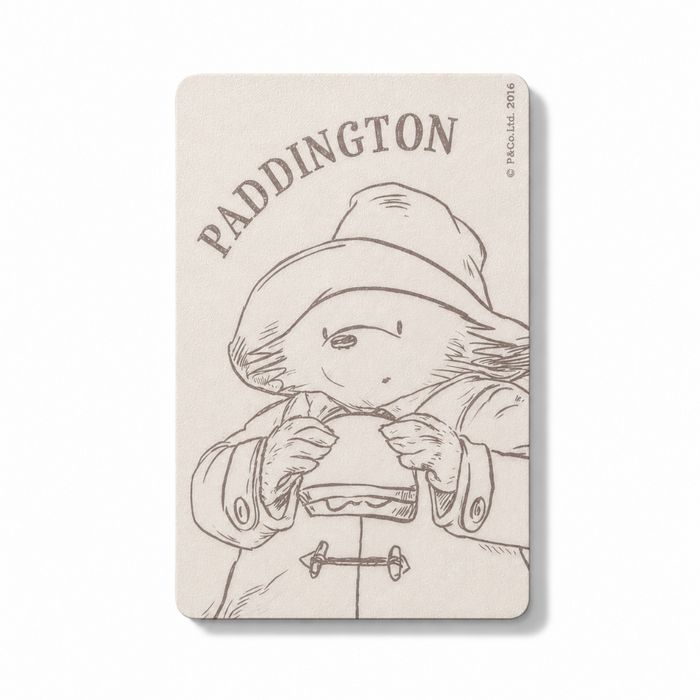 Magnet with Paddington Bear illustration and text on a white background