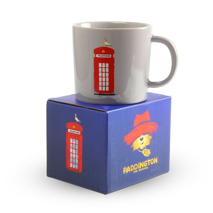 Mug with red telephone box design on a blue box featuring Paddington Bear, on a white background