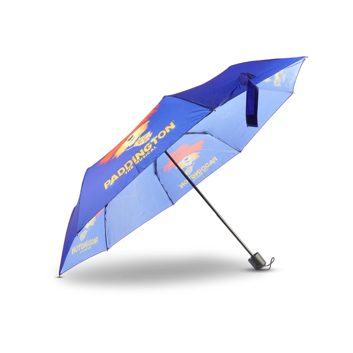 Blue umbrella with Paddington Bear branding on a white background