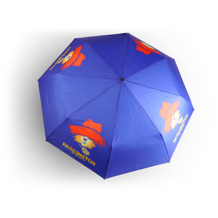 Blue umbrella with Paddington Bear graphics on a white background