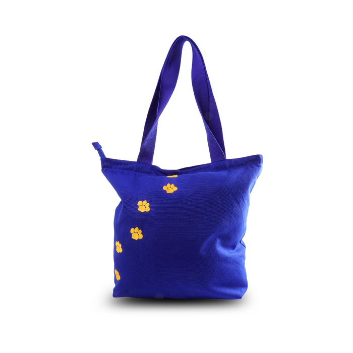 Blue tote bag with yellow paw prints on a white background