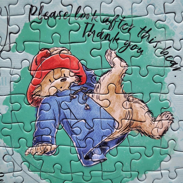 Jigsaw puzzle with a cartoon character and text on a teal background