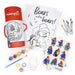 Paddington Bear art activity set with coloring pages, stickers, ink stamps, paints, plaster figurine and crayons on a white background