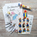 Paddington Art Set with Coloring pages, paints, stickers, stamps and stickers with Paddington Bear on a wooden surface.