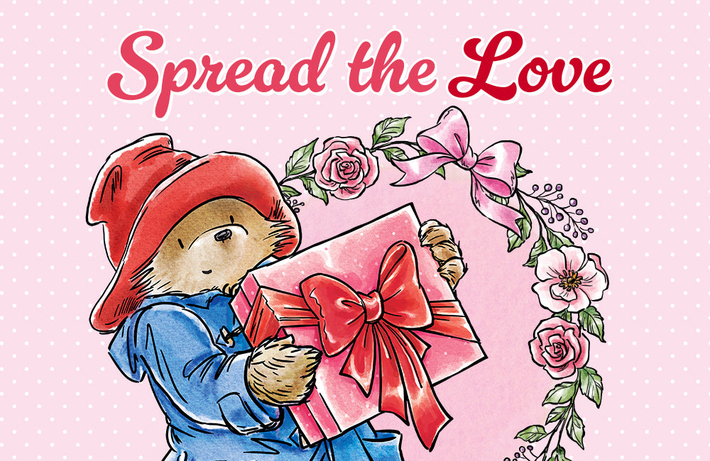 Paddington Bear Store Gift Card with Spread the love artwork and paddington holding a wrapped gift box