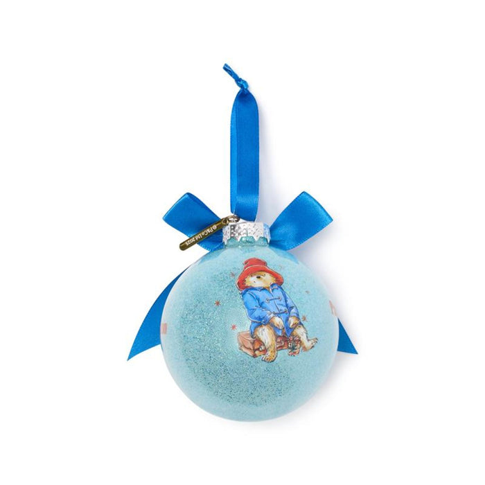 Blue Christmas ornament with a Paddington teddy bear design and blue ribbon on a white background