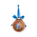 Orange Christmas ornament with a Paddington bear design, a blue ribbon on a white background