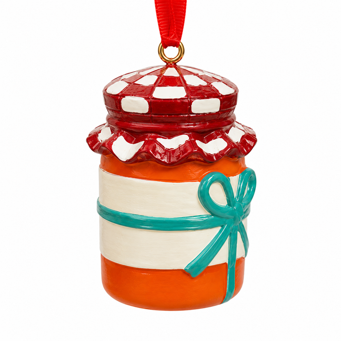 Decorative marmalade jar ornament with a red lid, white checkered pattern, orange body, and blue ribbon on a white background.