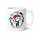 A white ceramic mug featuring a festive illustration of a Paddington bear Christmas character wearing a red Santa hat and green scarf, surrounded by holly leaves and the text 'HAVE A BEARY CHRISTMAS'.