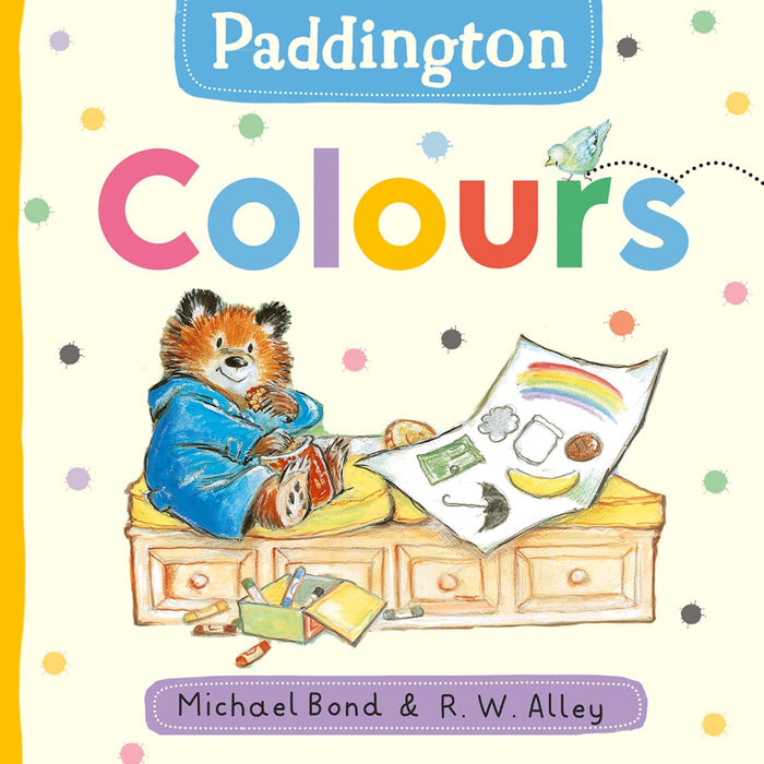 Book cover of 'Paddington Colours' featuring Paddington Bear with a rainbow and educational items.