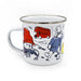 A white enamel camp mug with a silver metal rim, featuring a whimsical cartoon paddington bear illustration in a red hat, a red double-decker bus, and a bear figure in blue.