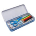 A blue patterned metal pencil case shown open on a white background, containing blue scissors, colored pencils, a pencil sharpener, and small paper inserts.
