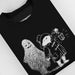 Black Halloween sweatshirt with a white graphic of a paddington bear and a ghost, featuring the brand 'Paddington'.