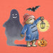 Illustration of Paddington bear in a blue coat with a lantern, ghost, bat, and pumpkin on an orange background
