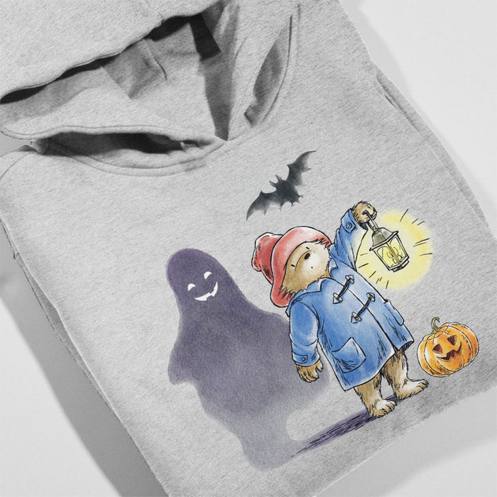 Gray hoodie with a Halloween-themed design featuring a ghost, Paddington bear in a coat with a lantern, and pumpkin.