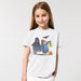 Child wearing a white t-shirt with a Halloween-themed design featuring a ghost, pumpkin, and Paddington bear in a duffle coat.