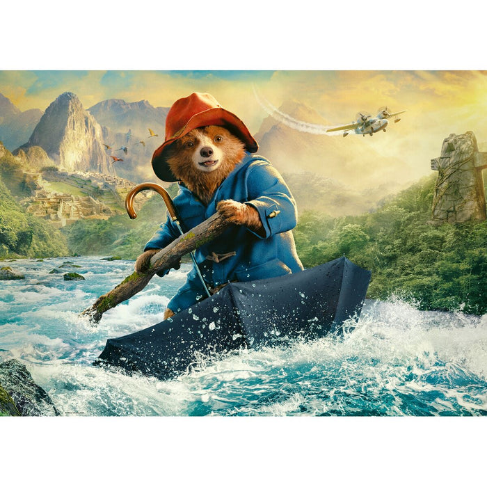 Animated bear character in a blue coat and red hat rowing a boat through a river with mountains and a helicopter in the background.