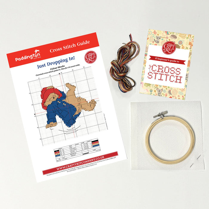 Paddington Cross stitch kit with pattern, thread, and hoop on a light background