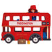 A wooden toy double-decker bus styled like a red London bus, with Paddington Bear visible inside behind a red hat and blue coat. The side of the bus reads “PADDINGTON” and “WINDSOR GARDENS,” with “LE TOY VAN” on the front, and a small brown suitcase and yellow bottle placed in front on a white background.
