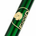 Close-up of a glossy dark green ballpoint pen with a gold circular Paddington logo and the visible text 'LOST & FOUND' on a white background.