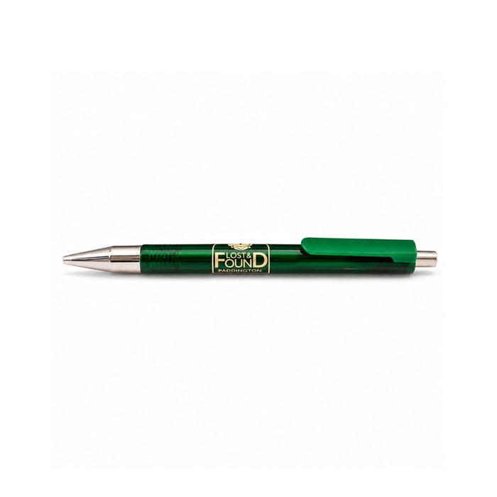 A green retractable pen with a metallic gold and black 'LOST & FOUND PADDINGTON' logo on the barrel, shown horizontally against a plain white background.