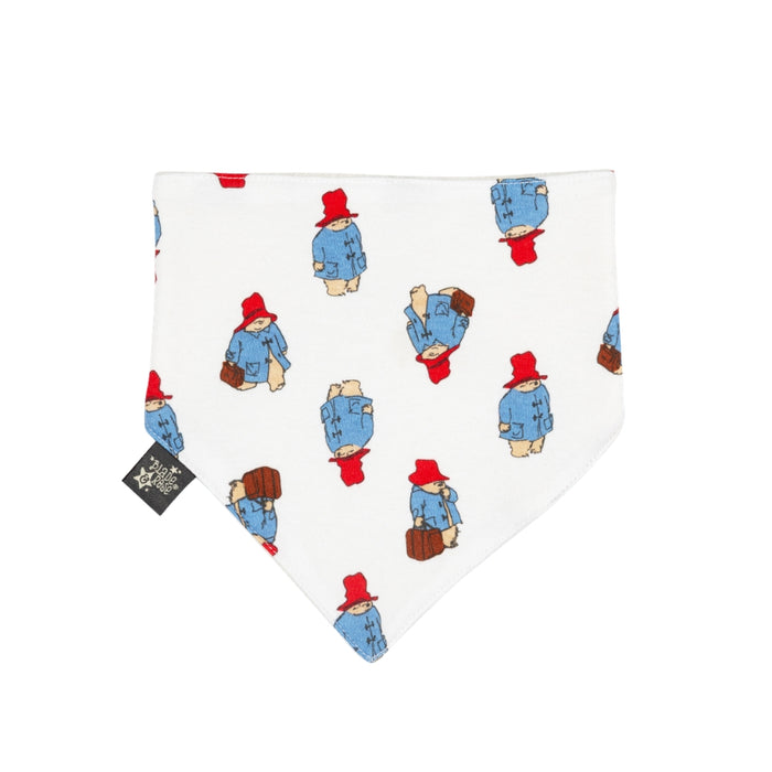 A white baby bib bandana with repeating paddington artwork all over