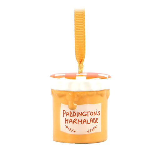 A ceramic hanging Christmas decoration shaped like a jar of marmalade with a 'Paddington's Marmalade' label, complete with a gingham-style lid and a satin ribbon loop.