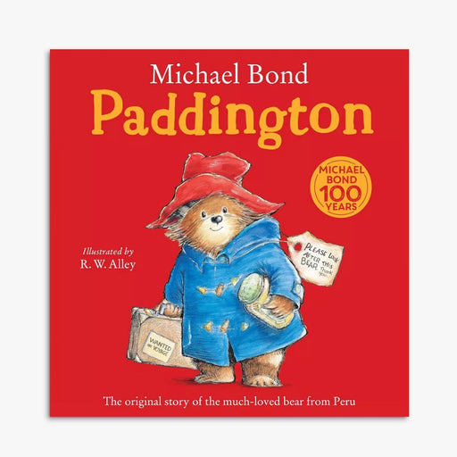 Book cover of 'Paddington' with a bear illustration on a red background