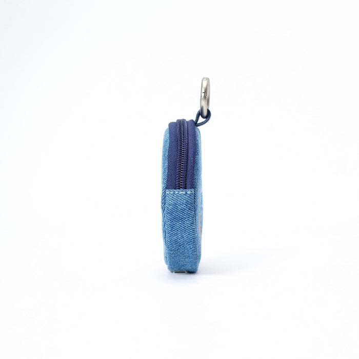 A small blue denim zippered pouch shown from the side on a clean white background, featuring a silver metal key ring attachment.