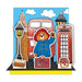 Cartoon bear in a blue coat with British icons like a red bus and phone box on a blue background.