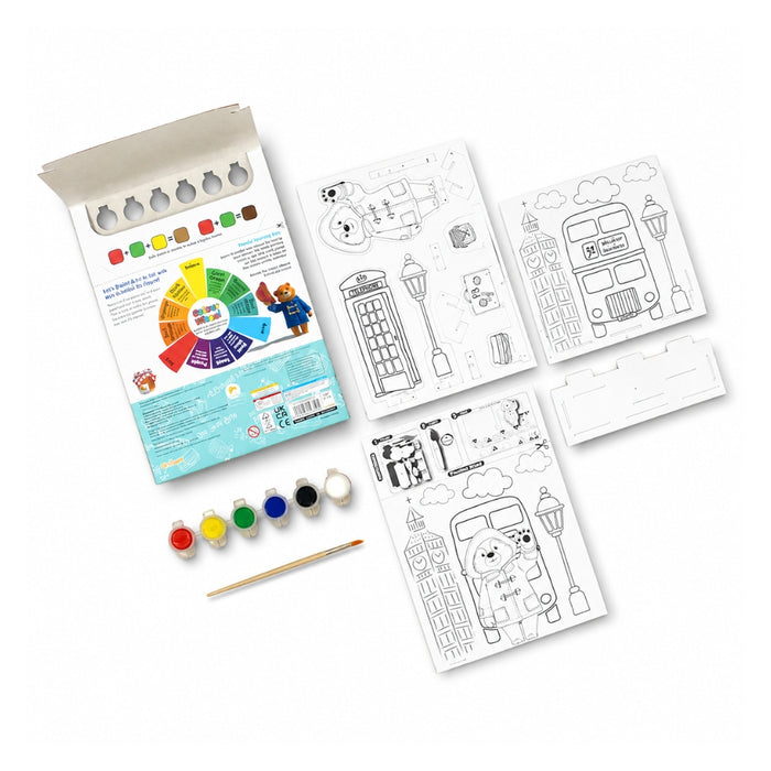 Coloring book set with coloring pages, paint, and brush on a white background