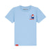 A light blue short-sleeve t-shirt featuring a small graphic of Paddington Bear on the left chest with the name 'PADDINGTON' printed below it. The brand name 'PADDINGTON' is also visible printed inside the collar and on a small red tag near the bottom hem.