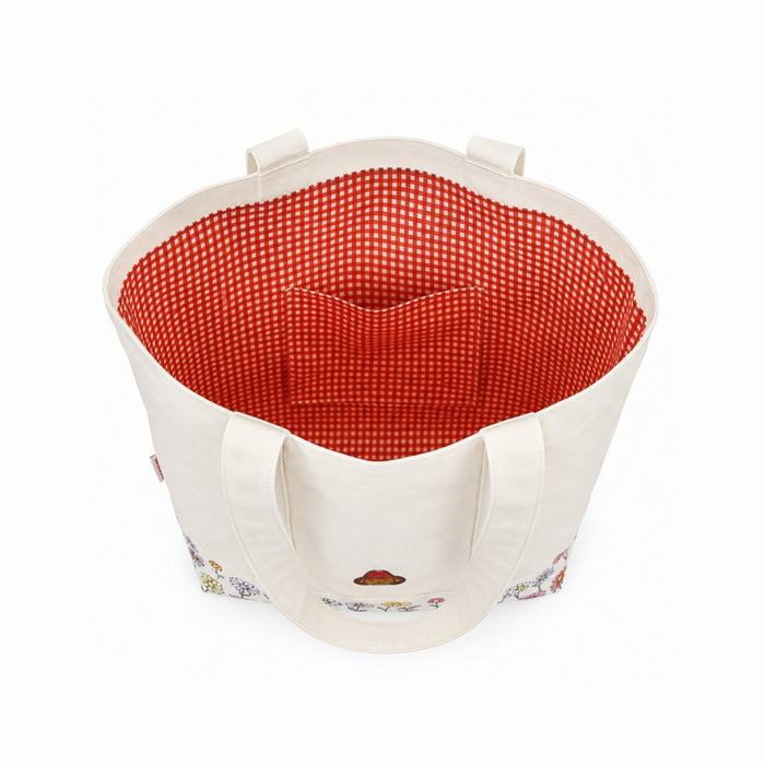 cream bag with red gingham interior and floral pattern on base, on a white background