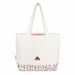 White shoulder tote bag with floral design and paddingtons face on a white background