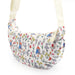Floral patterned bag with cartoon Paddington bear characters on a white background