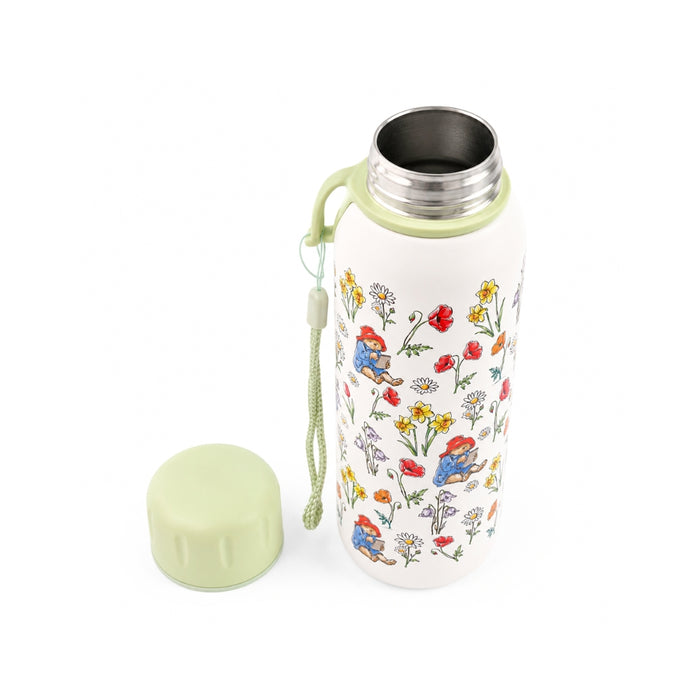 Floral-patterned and Paddington water bottle with a green lid on a white background