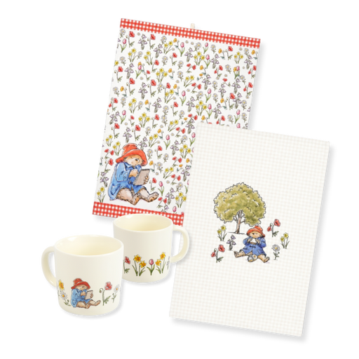 A kitchen tea-time set featuring a 2 floral mugs and two tea towels with a floral and Paddington Bear illustration, alongside a white checkered tea towel and a matching floral washcloth.