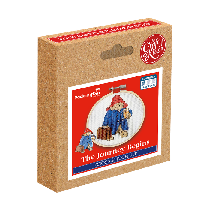 Cross stitch kit packaging with Paddington Bear design on a white background.
