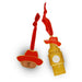 Two Paddington The Musical London-themed enamel christmas tree decorations on a white background: one shaped like Big Ben with a red hat and red ribbon hanger, and one shaped like paddington bear in a red hat with a red ribbon hanger. 