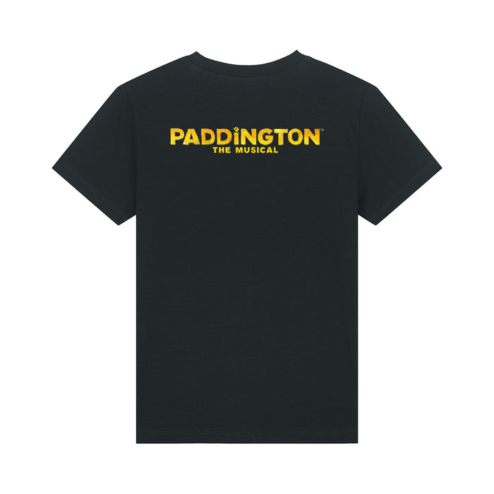 A black short-sleeve crewneck t-shirt featuring the yellow 'PADDINGTON THE MUSICAL' logo printed across the chest, displayed on a clean white background.
